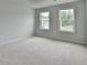 Bedroom featuring two bright windows allowing natural light at 1603 Maston Rd, Auburn, GA 30011