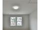 Minimalist bedroom with hardwood floors, a window, and natural light; ready for personalization at 1603 Maston Rd, Auburn, GA 30011