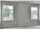 Bedroom featuring two bright windows allowing natural light at 1603 Maston Rd, Auburn, GA 30011