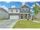 Charming two-story home featuring a brick facade and a well-maintained lawn, perfect for Gathering living at 1603 Maston Rd, Auburn, GA 30011