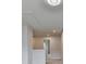 Bright hallway with neutral walls and carpet leading to various rooms in the home at 1603 Maston Rd, Auburn, GA 30011