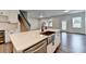 Kitchen features a large island with stainless steel sink and stainless steel dishwasher at 1603 Maston Rd, Auburn, GA 30011