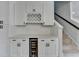Built in bar area with wine rack, beverage cooler and stairway access at 1603 Maston Rd, Auburn, GA 30011