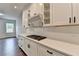 Modern kitchen with white cabinetry, gas cooktop, and countertops at 1603 Maston Rd, Auburn, GA 30011
