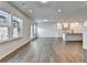 Hardwood floors and natural light throughout the home; the living room opens to the kitchen, great for entertaining at 1603 Maston Rd, Auburn, GA 30011