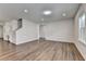 Open-concept living area with hardwood floors leading to kitchen and staircase at 1603 Maston Rd, Auburn, GA 30011