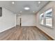 Bright, open living room featuring hardwood floors and recessed lighting at 1603 Maston Rd, Auburn, GA 30011