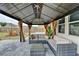 Open patio features a gazebo with seating, a firepit area, and a view of the backyard at 1603 Maston Rd, Auburn, GA 30011