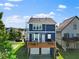 Rear exterior view featuring a wooden deck and a well-maintained backyard with a two car garage at 1783 Drew Nw Dr, Atlanta, GA 30318