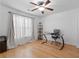 Comfortable bedroom featuring hardwood floors, a ceiling fan, and lots of natural light at 1783 Drew Nw Dr, Atlanta, GA 30318