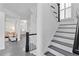 Bright home entryway with hardwood floors, white walls, and staircase leading to the upper level at 1783 Drew Nw Dr, Atlanta, GA 30318