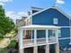 A charming blue two-story home featuring a covered front porch and a well-maintained exterior at 1783 Drew Nw Dr, Atlanta, GA 30318