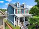 Two story home with blue siding, white trim and a covered front porch at 1783 Drew Nw Dr, Atlanta, GA 30318