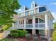 Charming two-story home with inviting front porch, beautiful columns, and well-manicured landscaping at 1783 Drew Nw Dr, Atlanta, GA 30318
