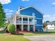 Side exterior of a beautiful two-story home with a spacious porch and well-maintained lawn at 1783 Drew Nw Dr, Atlanta, GA 30318