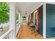 Charming front porch with a cozy seating area, perfect for relaxing outdoors at 1783 Drew Nw Dr, Atlanta, GA 30318