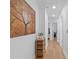 Inviting hallway featuring hardwood floors, neutral walls, and decorative touches at 1783 Drew Nw Dr, Atlanta, GA 30318