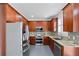 Modern kitchen features stainless steel appliances, granite countertops, and wooden cabinetry at 1783 Drew Nw Dr, Atlanta, GA 30318