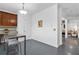 Eat-in kitchen area with bar seating, white walls, and an open doorway to the living room at 1783 Drew Nw Dr, Atlanta, GA 30318