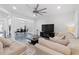 Bright living room with a sectional sofa, a modern ceiling fan, and an open layout at 1783 Drew Nw Dr, Atlanta, GA 30318