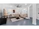 Bright living room featuring neutral walls, plush seating, and a stylish ceiling fan at 1783 Drew Nw Dr, Atlanta, GA 30318
