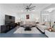 Bright living room with hardwood floors, plush sofas, and large windows with shutter blinds at 1783 Drew Nw Dr, Atlanta, GA 30318