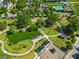 Aerial view of the community park featuring a pond, walking path, and playground surrounded by lush trees at 1783 Drew Nw Dr, Atlanta, GA 30318