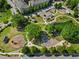 Aerial view of the community park including the playground, walking trail, baseball field and green spaces at 1783 Drew Nw Dr, Atlanta, GA 30318