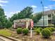 Community signage for West Highlands at Perry Boulevard with attractive landscaping at 1783 Drew Nw Dr, Atlanta, GA 30318