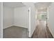 A secondary bedroom with carpeted floors and an open door into the main living space at 3970 Brushy St, Powder Springs, GA 30127