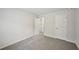 Cozy bedroom featuring soft carpeting, closet, and white trim at 3970 Brushy St, Powder Springs, GA 30127