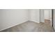 A secondary bedroom with carpeted floors, light grey walls, and a door leading to the hallway at 3970 Brushy St, Powder Springs, GA 30127