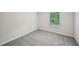 Bright bedroom featuring a window and soft gray carpeting at 3970 Brushy St, Powder Springs, GA 30127