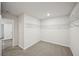 Walk-in closet with wire shelving and neutral carpeting offers ample storage space at 3970 Brushy St, Powder Springs, GA 30127