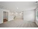Spacious hallway features plush carpet, white walls, and multiple entryways to bedrooms at 3970 Brushy St, Powder Springs, GA 30127