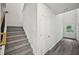 Hallway with staircase features durable flooring and a well-lit entry to the home at 3970 Brushy St, Powder Springs, GA 30127