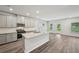 Contemporary kitchen with granite countertops, stainless steel appliances, and ample cabinet space at 3970 Brushy St, Powder Springs, GA 30127