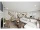 Staged living room showcases an open floor plan connecting the kitchen, dining, and seating areas at 3970 Brushy St, Powder Springs, GA 30127