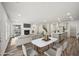 Staged open-concept living area features stylish furniture, a fireplace, and seamless flow to the kitchen at 3970 Brushy St, Powder Springs, GA 30127