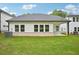 Backyard view features a well-manicured lawn and the rear facade of the home at 3974 Brushy St, Powder Springs, GA 30127