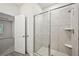Bathroom features a glass shower and an open door leading to the bedroom at 3974 Brushy St, Powder Springs, GA 30127