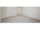 Bedroom with neutral carpet, white walls, and doors leading to other rooms in the house at 3974 Brushy St, Powder Springs, GA 30127
