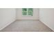 Bright bedroom with neutral walls, carpet, trim, and a pair of windows providing natural light at 3974 Brushy St, Powder Springs, GA 30127