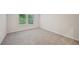 Bright bedroom with neutral walls, carpet, trim, and a pair of windows providing natural light at 3974 Brushy St, Powder Springs, GA 30127