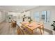 Bright dining room open to a kitchen featuring hardwood floors and lots of natural light at 3974 Brushy St, Powder Springs, GA 30127