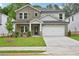 Inviting two-story home with stone accents, well-manicured lawn, and a two-car garage at 3974 Brushy St, Powder Springs, GA 30127