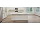 Spacious kitchen features a large island, stainless steel appliances, and lots of cabinets at 3974 Brushy St, Powder Springs, GA 30127