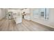 Modern kitchen with stainless steel appliances, a large island, and ample cabinet space at 3974 Brushy St, Powder Springs, GA 30127