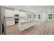 Modern kitchen with stainless steel appliances, island, and bright lighting at 3974 Brushy St, Powder Springs, GA 30127
