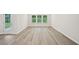 Bright living room with hardwood floors and ample windows at 3974 Brushy St, Powder Springs, GA 30127
